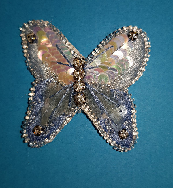 Papillon bleu brodé